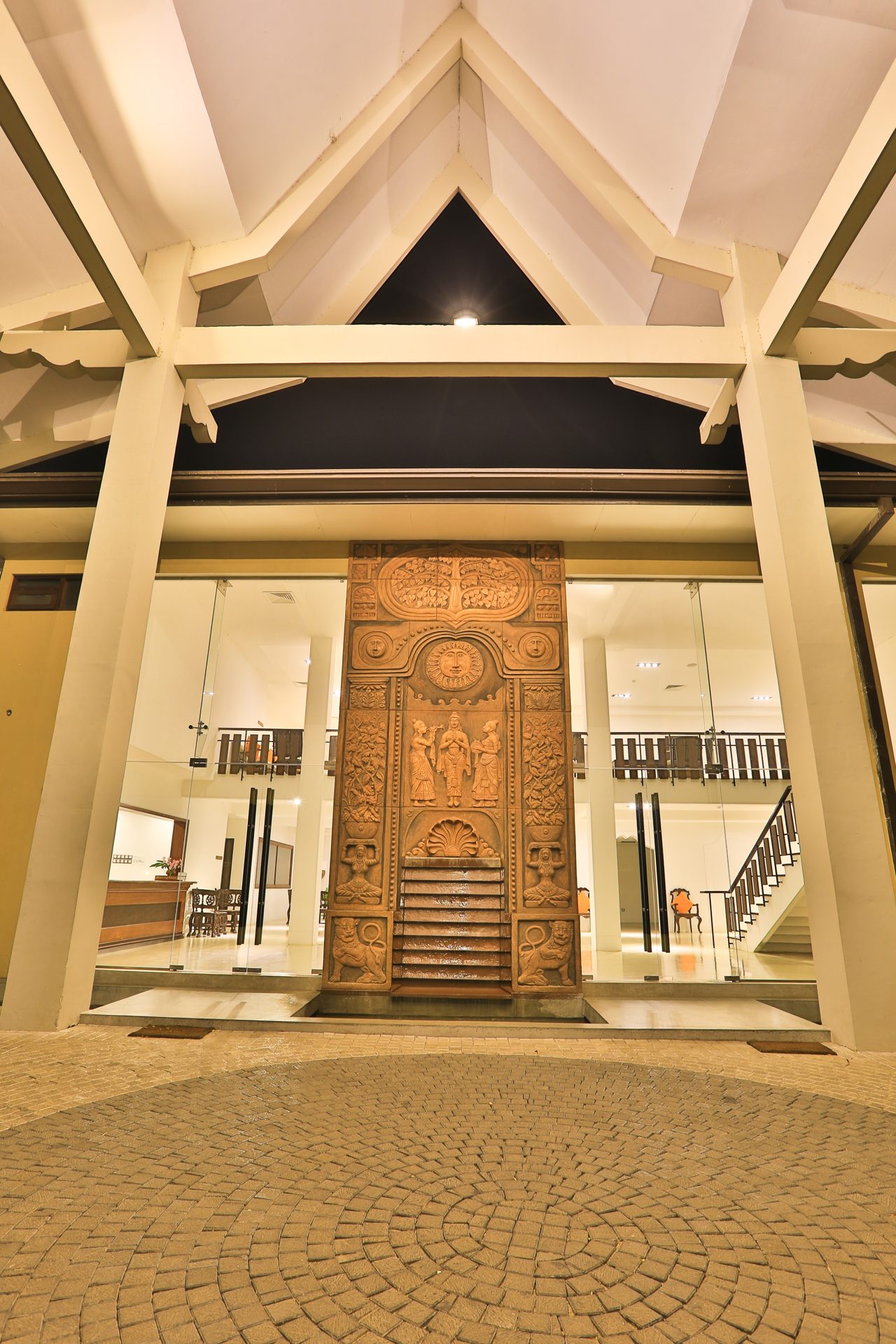 Ornate carved wooden entrance door at Rajarata Hotel